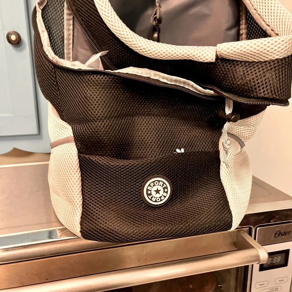 Portable new doggie backpack. Medium dog size. Oxford style. Pockets.Harness