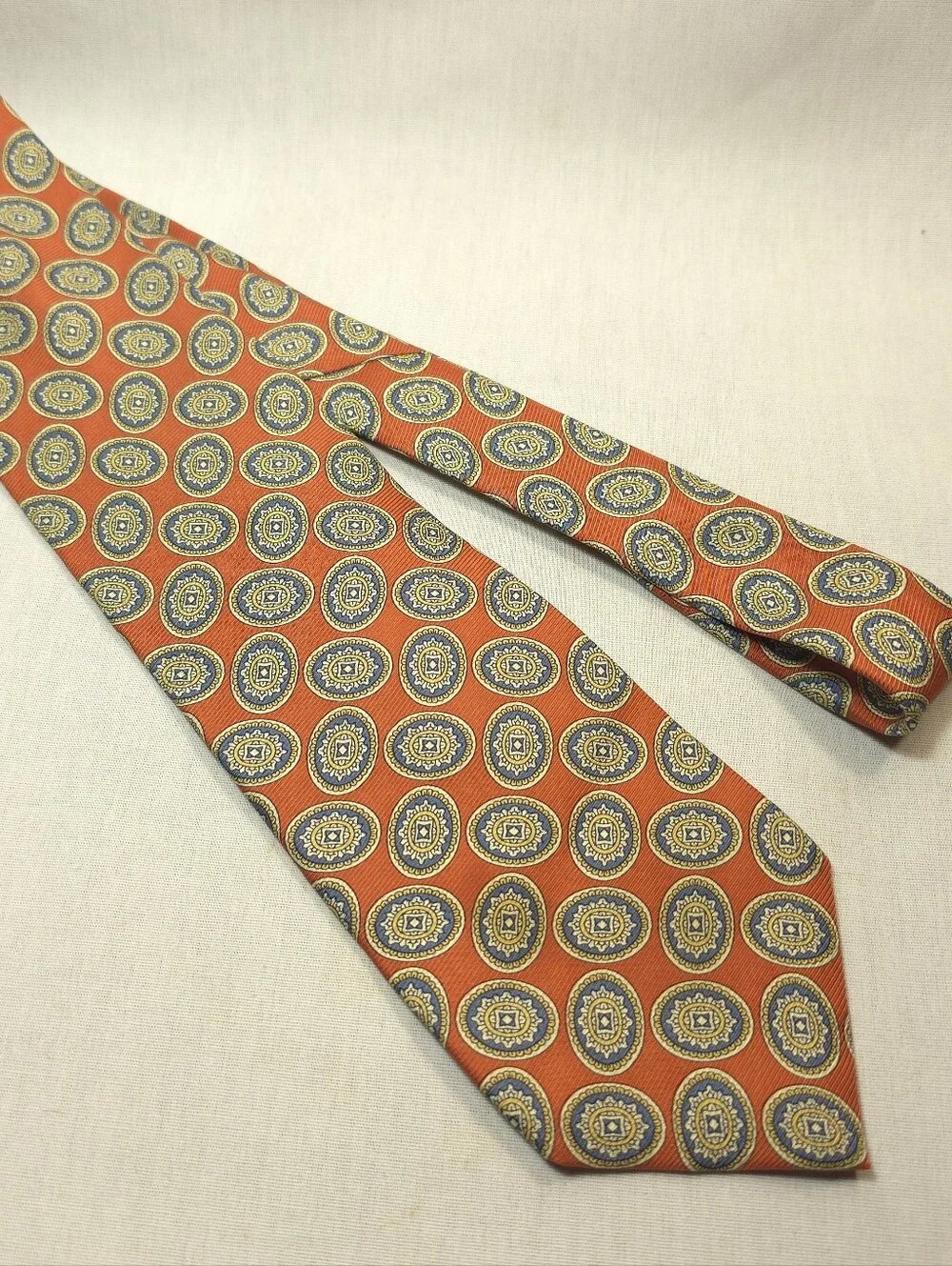 Jos. A. Bank Orange Tie with Blue and Gold Medallions
