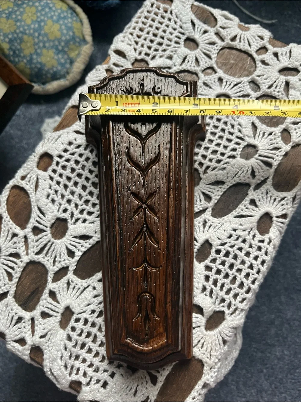 Carved Dark Wood Wall Pocket Vase will include a sprig of greenery