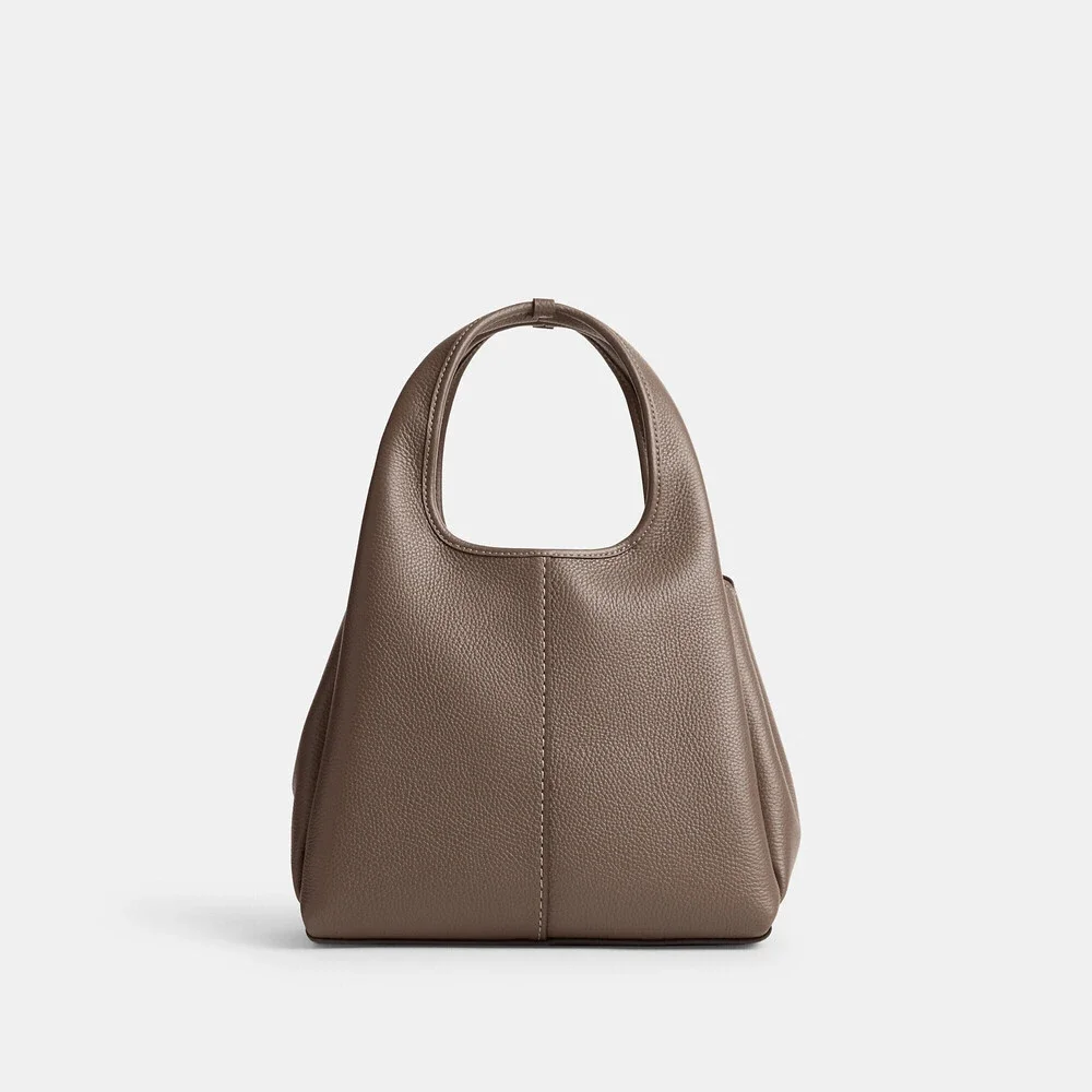 Coach polished pebble